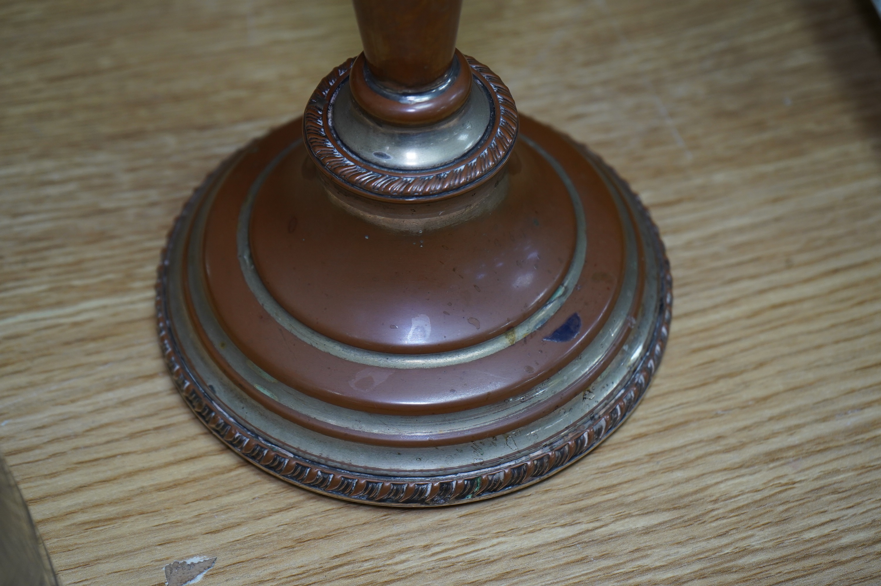 A Victorian silver plated claret jug, together with a pair of candelabra, 30cm. Condition - worn